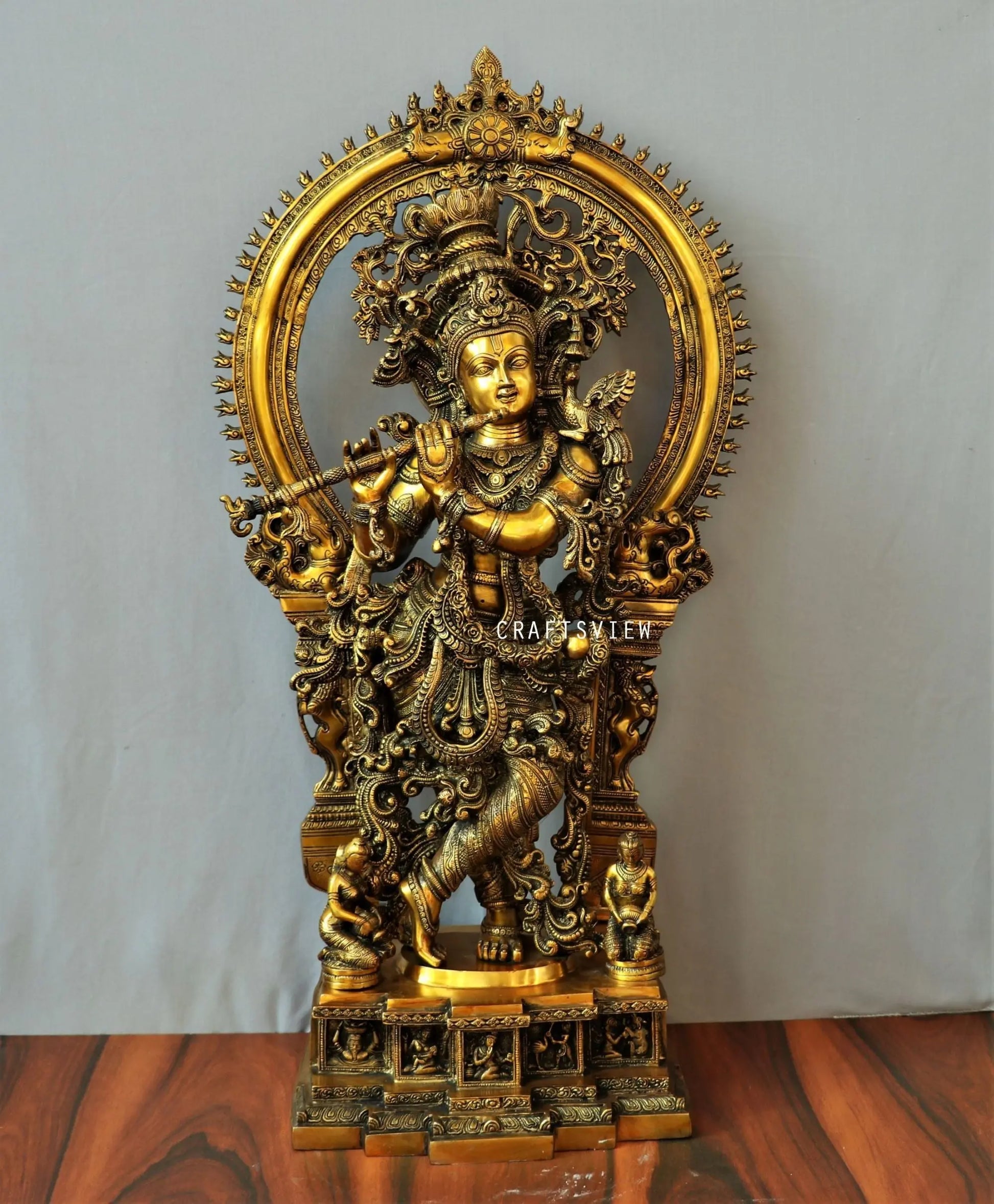 Lord Krishna stands on an engraved base with Frame 32" craftsview