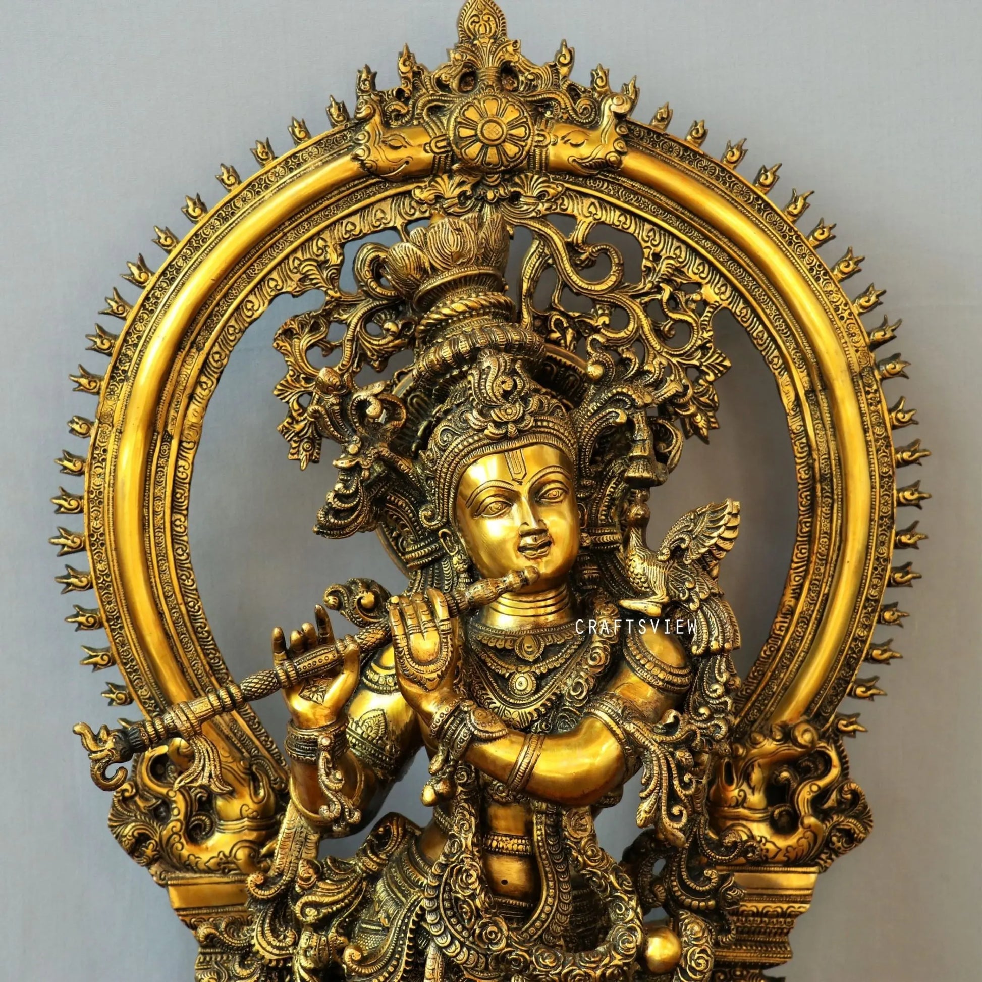 Lord Krishna stands on an engraved base with Frame 32" craftsview