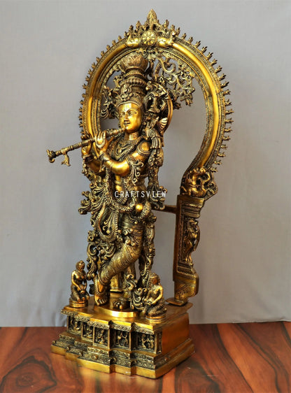 Lord Krishna stands on an engraved base with Frame 32" craftsview