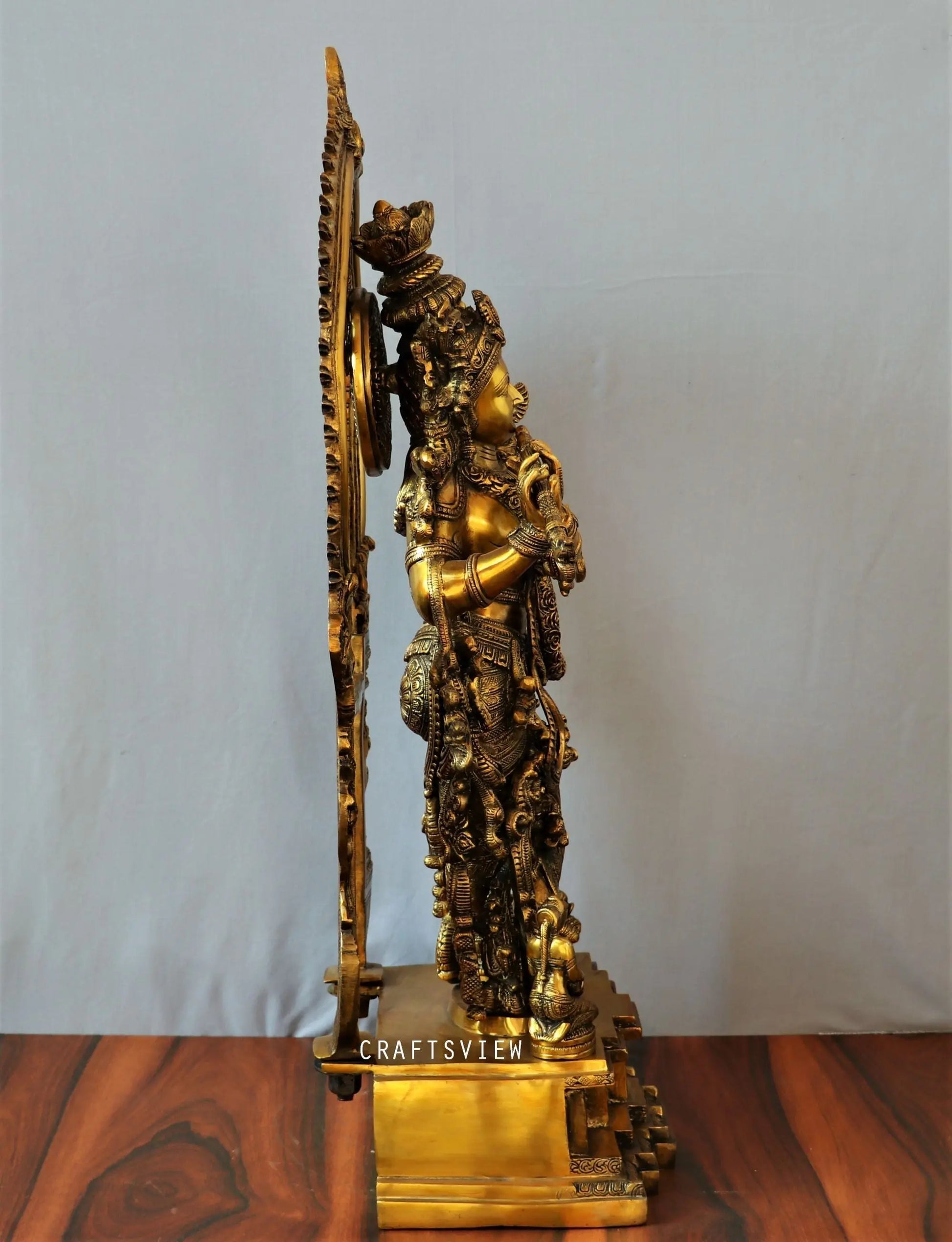 Lord Krishna stands on an engraved base with Frame 32" craftsview